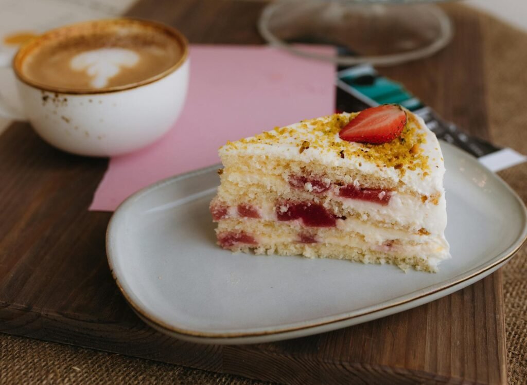 Tasty sugar free strawberry cake slice with cappuccino coffee.