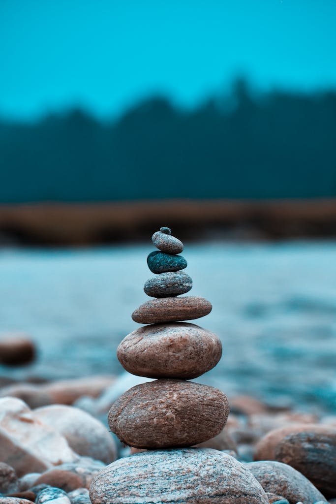 Close-up of balanced stones stacked by a river in Batabari, India.