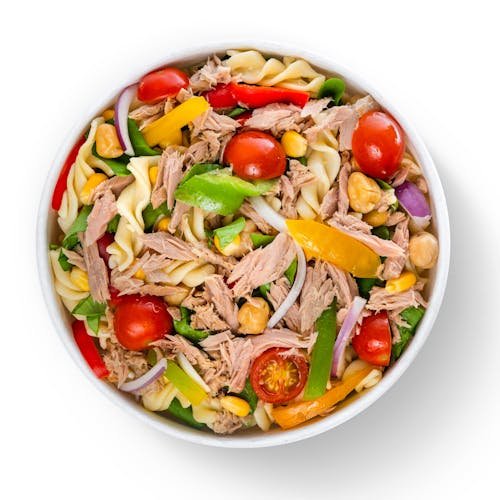 Vibrant tuna pasta salad with cherry tomatoes and vegetables over a white background.